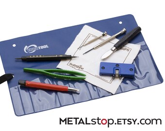 9 Piece Watch Battery Tool Set for changing your own watch batteries. Includes all the tools you need in an organizer pouch.