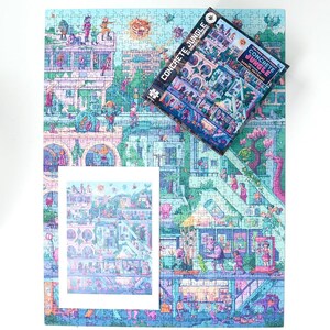 May include: A completed jigsaw puzzle with a colorful illustration of a city scene, with a matching puzzle box and a smaller print of the image. The puzzle features the text "CONCRETE JUNGLE" and is set against a white background.