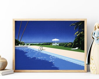 May include: A framed print of a retro-style illustration depicting a swimming pool with a blue tiled bottom, surrounded by lush green palm trees and a white umbrella. The pool is empty and the water is clear and blue. The sky is a deep blue with white clouds.