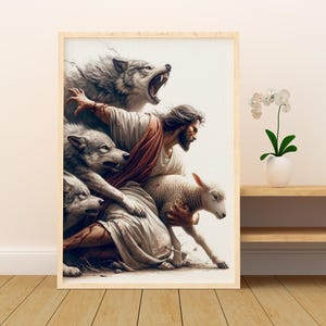 Puede incluir: Obra de arte enmarcada que representa una escena b&iacute;blica. Una figura con t&uacute;nicas blancas y una faja roja protege a un cordero de lobos gru&ntilde;endo. La obra est&aacute; sobre un fondo blanco, enmarcada en madera clara y expuesta sobre una superficie de madera.