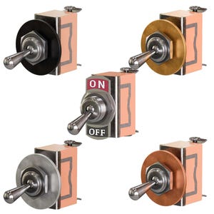 Puede incluir: Una colección de interruptores de palanca con placas circulares de varios colores y carcasas rectangulares de color melocotón. Un interruptor muestra el texto "ON" y "OFF". Los interruptores tienen palancas plateadas.