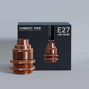 May include: A copper-toned E27 lamp holder with a conduit pipe design. The image shows the lamp holder next to its packaging, which includes the text "CONDUIT PIPE LIGHTING LAMP HOLDER" and "E27 LAMP HOLDER". The lamp holder is approximately 20mm in diameter.