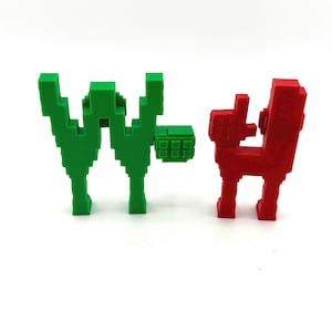 May include: Two pixelated sculptures. One is green and shaped like the letter "W" with a small square attached. The other is red and resembles a dog or similar animal. Both are on a white background.