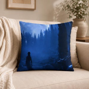 May include: Square throw pillow featuring a serene, blue-toned landscape with a figure walking up stairs towards a forest. The design evokes a sense of mystery and tranquility, perfect for home decor.