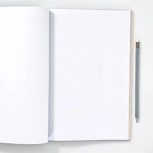May include: An open, blank notebook with a light brown spine and a gray pencil with an eraser. The notebook is on a white surface, ready for writing or drawing. The pencil is positioned vertically.