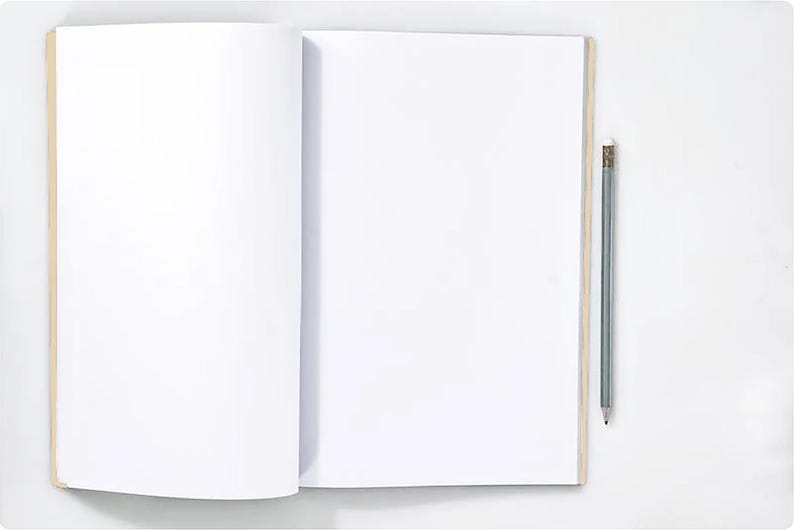 May include: An open, blank notebook with a light brown spine and a gray pencil with an eraser. The notebook is on a white surface, ready for writing or drawing. The pencil is positioned vertically.