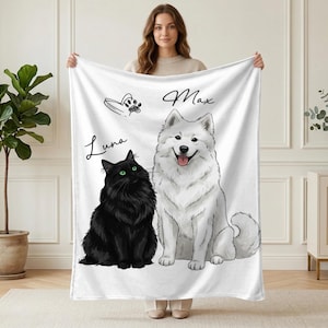 May include: White blanket featuring illustrations of a black cat named Luna and a white dog named Max. The cat has green eyes, and the dog has its tongue out. The blanket also has a paw print and the names Luna and Max written in cursive.