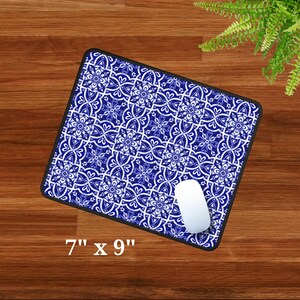 May include: Blue and white patterned mouse mat with a white computer mouse on top. The mouse mat measures 7 inches by 9 inches.