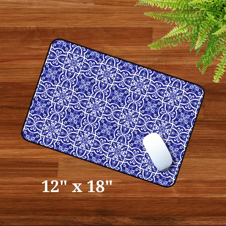May include: Blue and white patterned mouse mat with a white computer mouse on top. The mouse mat is 12 inches by 18 inches.