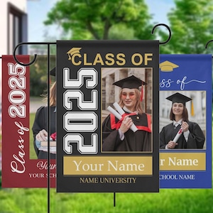 May include: Three graduation garden flags. The central flag is black with "CLASS OF 2025" and a photo of a graduate. The bottom has "Your Name" and "NAME UNIVERSITY". The other flags are burgundy and blue with similar designs.
