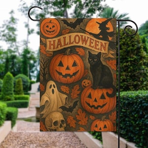 May include: Halloween garden flag with a black cat on a carved pumpkin, surrounded by jack-o'-lanterns, a ghost, and a skull. The flag has the word "Halloween" on a banner, with a witch silhouette and bats. The background is a garden.