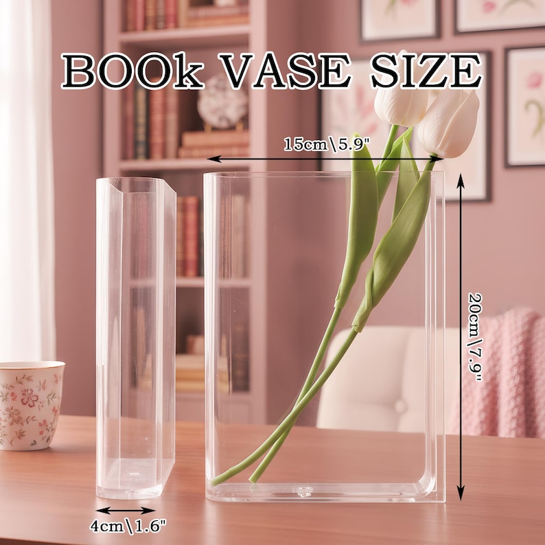 May include: Two clear rectangular book-shaped vases. One vase contains two white artificial tulips with green stems. The image includes text reading BOOK VASE SIZE and dimensions: 15cm/5.9 inches wide, 20cm/7.9 inches high, and 4cm/1.6 inches deep.