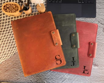 May include: Three leather folders with personalized names, "Steve", "James", and "Linda", in brown, green, and red.