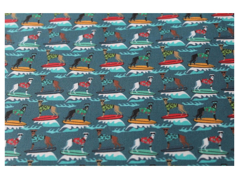 May include: A teal blue fabric with a repeating pattern of dogs wearing sunglasses and Hawaiian shirts riding surfboards on turquoise waves.