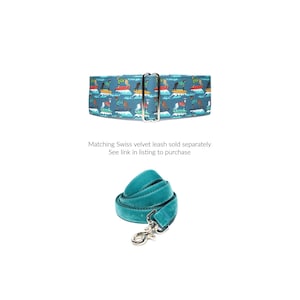 May include: A teal blue dog collar with a colorful print of dogs surfing. Matching Swiss velvet leash sold separately. See link in listing to purchase.
