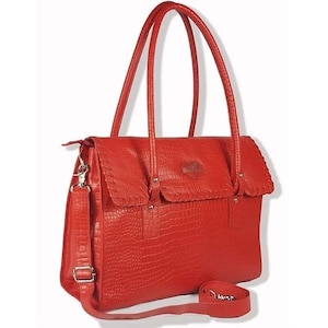 May include: A red leather handbag with a crocodile embossed pattern and a top flap closure. The bag has two top handles and a detachable shoulder strap.