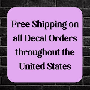 May include: A light purple, rounded rectangle with black text on a black brick background. The text reads "Free Shipping on all Decal Orders throughout the United States."