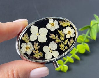 Pastillero de 2 compartimentos con flores secas
