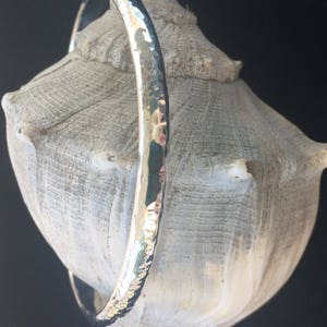 Hand forged sterling silver bangle