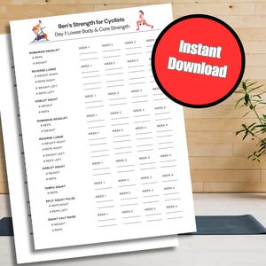 May include: A white printable workout sheet titled "Ben's Strength for Cyclists" with exercises for lower body and core strength. Includes a red circle with "Instant Download" text. The sheet is on a black mat.