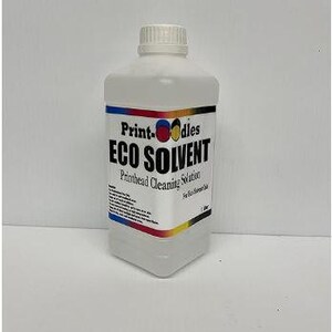 May include: A white plastic bottle of Print-Oodles Eco Solvent printhead cleaning solution. The label features the product name in large, bold letters, with colorful accents. The bottle has a white cap and is filled with a clear liquid. The bottle is 1 liter.