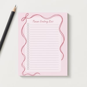 May include: Pink notepad with a pink ribbon border and the text "Never Ending List" printed on the front.
