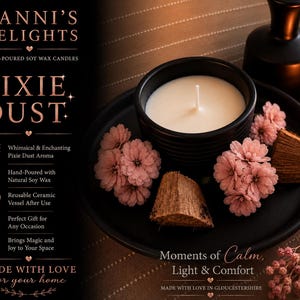 May include: A black ceramic vessel containing a white soy wax candle, placed on a matching black plate with pink flowers and wood pieces. Text on the left reads DANNI'S DELIGHTS PIXIE DUST, with additional details about hand-poured soy wax.