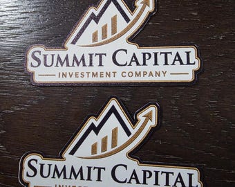 May include: Two stickers with the text "SUMMIT CAPITAL INVESTMENT COMPANY". The logo features a mountain design with a rising arrow, and three vertical bars. The stickers have a white background with a gold and black design.