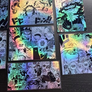 May include: A set of six holographic stickers featuring scenes from the popular anime One Piece. The stickers are printed on a black background with a rainbow iridescent finish. The stickers feature characters from the anime, including Luffy, Zoro, and Sanji. The stickers are perfect for adding a touch of anime style to your laptop, phone, or water bottle.