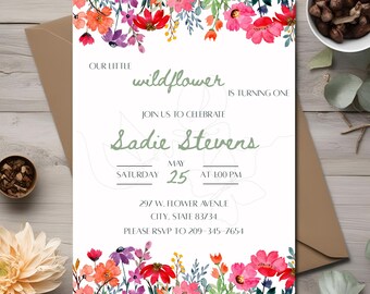 May include: A white invitation with a floral border. The text reads "Our little wildflower is turning one. Join us to celebrate Sadie Stevens Saturday May 25 at 1:00 PM. 297 W. Flower Avenue City, State 83734 Please RSVP to 209-345-7654"