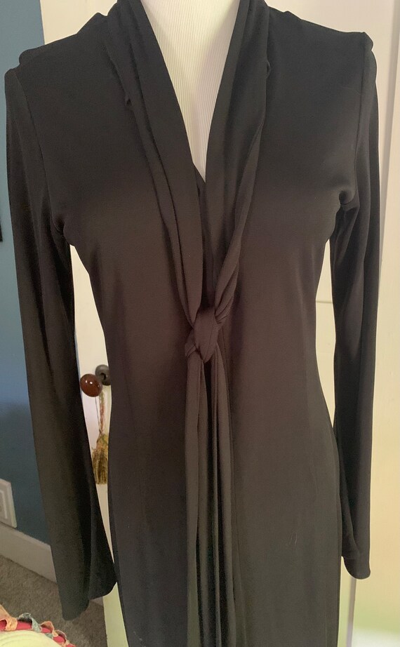 Sleek black knit cocktail dress long bell sleeves 