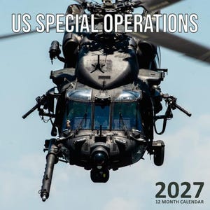May include: A 2027 12 month calendar featuring a black military helicopter in flight. The text US SPECIAL OPERATIONS is printed in white at the top, and 2027 12 MONTH CALENDAR is printed in black at the bottom right against a light blue sky.