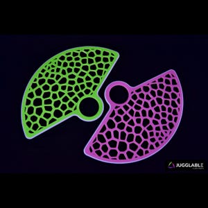 May include: Two juggling poi heads, one green and one pink, with a white, intricate, geometric pattern. The poi heads are made of a flexible, durable material and are designed for use with juggling poi.