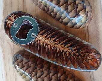 Handmade bottle opener made from spruce cones and epoxy resin – rustic nature meets modern design