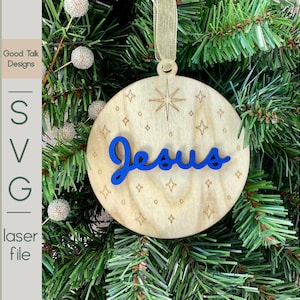 Adorno de Jesús SVG: Diseño navideño religioso en capas con estrella ranurada en el reverso. Archivo digital cortado con láser para decoración navideña cristiana.