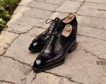 Zapatos Oxford con cordones y punta de cuero negro a medida para hombre de Skin Smith.