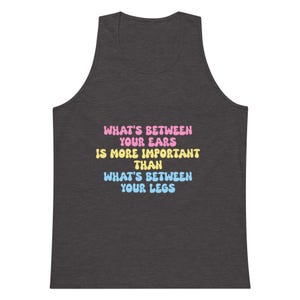 LGBTQIA+ Premium Tank Top – “What’s Between Your Ears…” | Gender-Inclusive Quote Muscle Tank | Pride Workout Shirt | Queer Empowerment Gift
