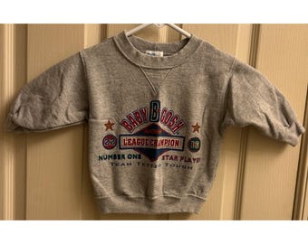 Vintage 90-tals Baby B'Gosh Born To Win League Champion-tröja 12 månader SÄLLSYNTA