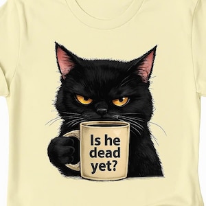 May include: A light yellow t-shirt with a black cat holding a coffee mug that says "Is he dead yet?"