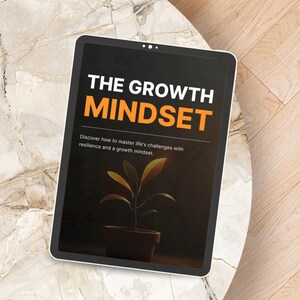 May include: A digital tablet displays the text "THE GROWTH MINDSET" in white and orange. Below the title, the text reads "Discover how to master life's challenges with resilience and a growth mindset." A small potted plant is visible on the screen.