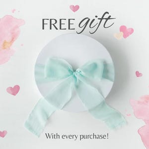 May include: A white round gift box with a light blue ribbon bow. The words "FREE gift" are above the box, and "With every purchase!" is below. Pink watercolor hearts and splashes decorate the white background.