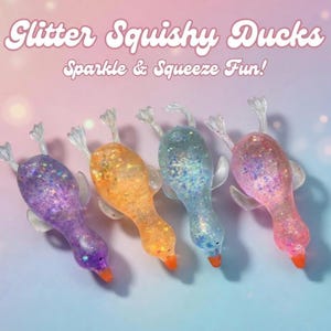 May include: Four glittery squishy duck toys in purple, orange, blue, and pink. Each duck has a clear plastic beak, feet, and wings. The text "Glitter Squishy Ducks" and "Sparkle & Squeeze Fun!" are displayed above the ducks.