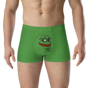 Peut inclure: Boxer en coton vert avec un imprimé de visage de grenouille de dessin animé.