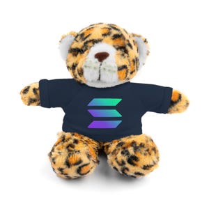 May include: A plush leopard teddy bear wearing a navy blue t-shirt with a colorful gradient logo of three overlapping bars.