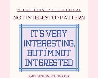 May include: A needlepoint stitch chart with the text "NOT INTERESTED PATTERN." The design features a blue and white cross-stitch pattern with the words "IT'S VERY INTERESTING, BUT I'M NOT INTERESTED." The design is framed in a blue border.