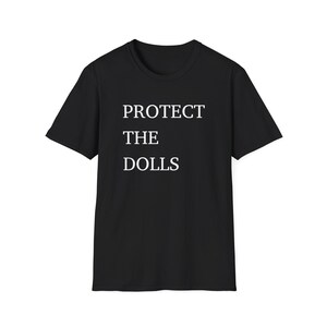 Protect the Dolls Unisex Softstyle T-Shirt, Casual Graphic Tee for Doll Lovers, Gift for Birthdays, Collectors Shirt, Funny Statement Tee