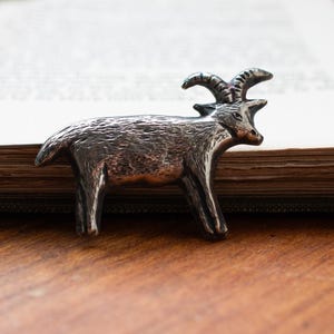 Goat brooch