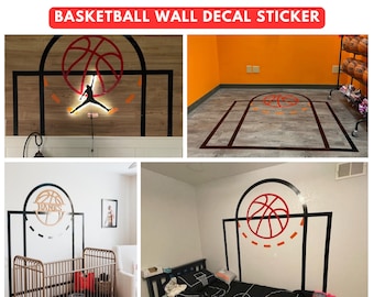 May include: A basketball wall decal sticker with a black outline and orange and red details. The decal features a basketball hoop with a basketball going through the hoop. The decal is shown on a white wall in a bedroom with a crib and a bed.