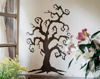 May include: A black silhouette of a tree with twisting branches against a white wall. The tree is a wall decal and is a popular home decor item.