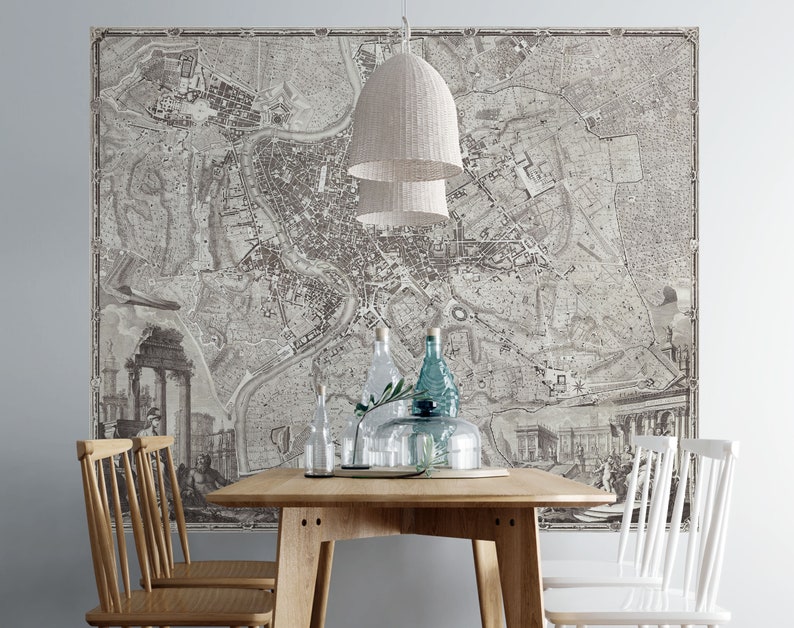 May include: A vintage map of Rome printed on a wall mural, with a wooden dining table and chairs in front of it. The table is set with glass bottles and a plant.